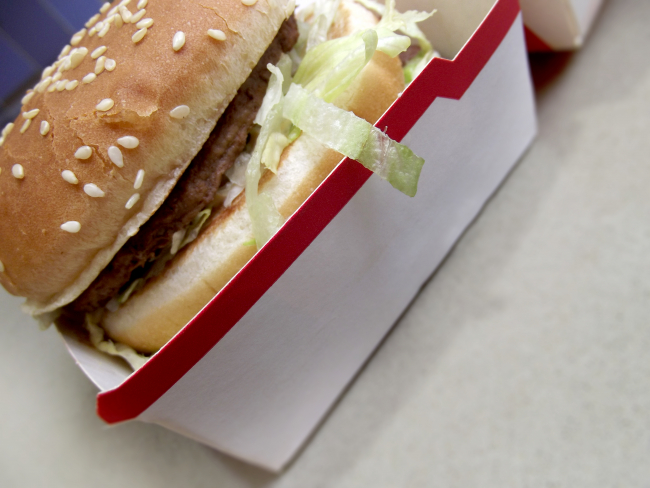 closeup of a hamburger in a fast food tray